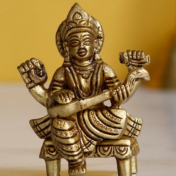 Golden Handcrafted Brass Goddess Saraswati Idol On Chowki