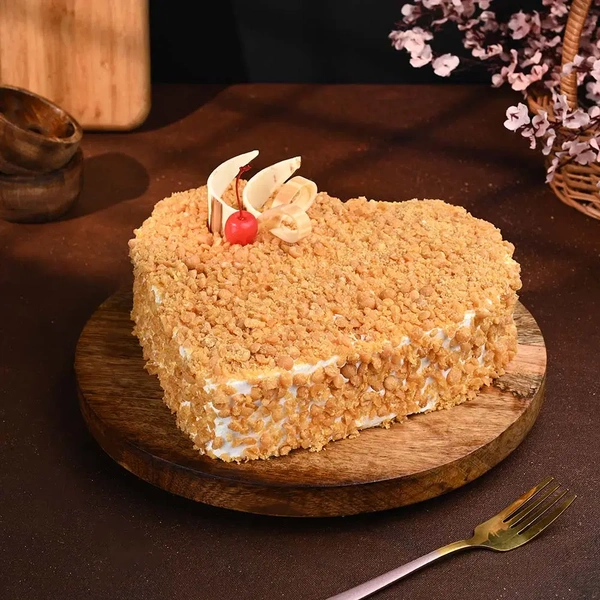 Heart Shaped Butterscotch Cherry Topped Cake - 500 Gm
