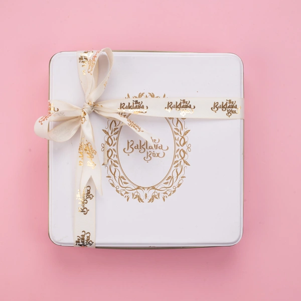 Assorted White Tin Chocolate Box With Ribbon Packing - 1 Kg
