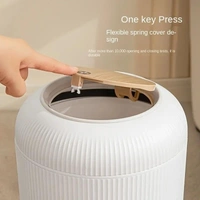 Stylish floor-standing dustbin with modern ribbed design, Plastic legs, and a flip-top lid. Perfect for kitchens, living rooms, and offices, offering functionality with elegant décor.