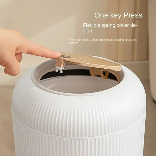 Stylish floor-standing dustbin with modern ribbed design, Plastic legs, and a flip-top lid. Perfect for kitchens, living rooms, and offices, offering functionality with elegant décor.