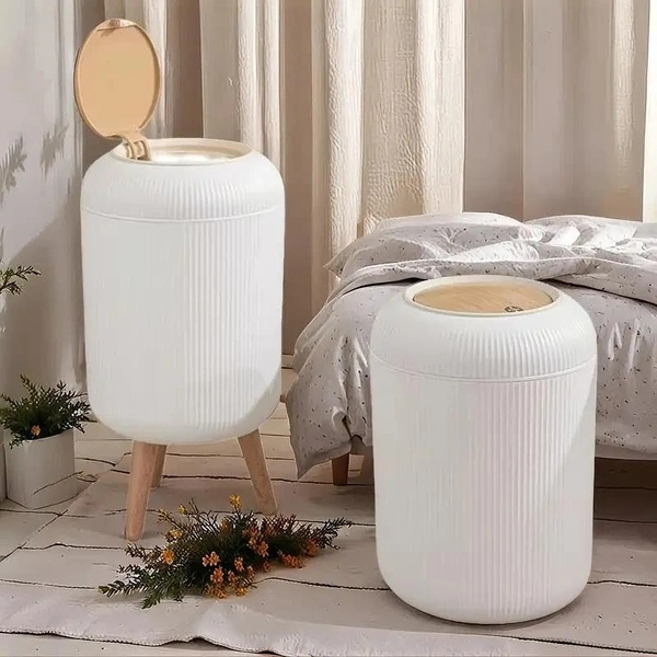 Stylish floor-standing dustbin with modern ribbed design, Plastic legs, and a flip-top lid. Perfect for kitchens, living rooms, and offices, offering functionality with elegant décor.