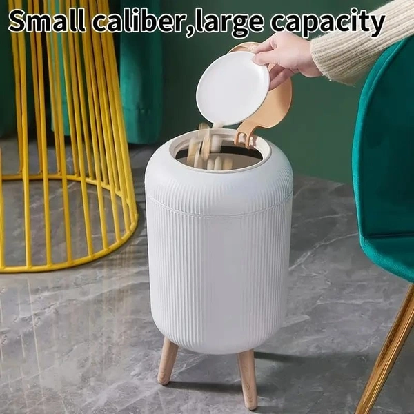 Stylish floor-standing dustbin with modern ribbed design, Plastic legs, and a flip-top lid. Perfect for kitchens, living rooms, and offices, offering functionality with elegant décor.