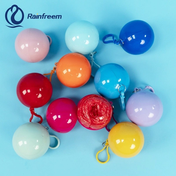Portable Disposable Waterproof Compression Poncho Raincoat in Keychain Printed Pocket Balls for Adults Kids