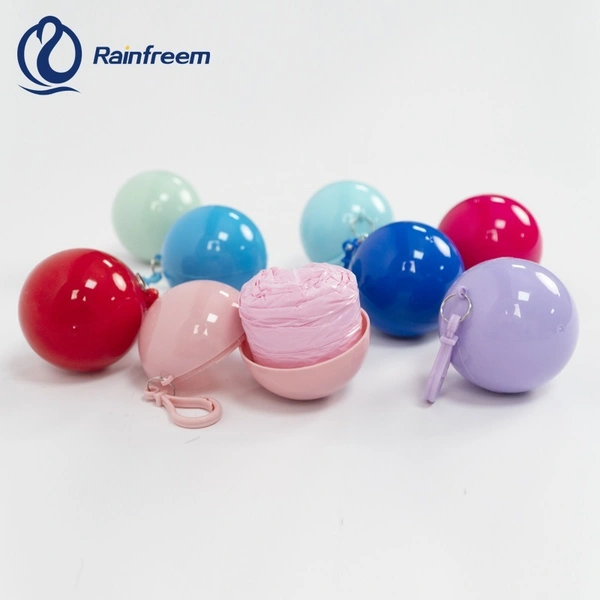 Portable Disposable Waterproof Compression Poncho Raincoat in Keychain Printed Pocket Balls for Adults Kids