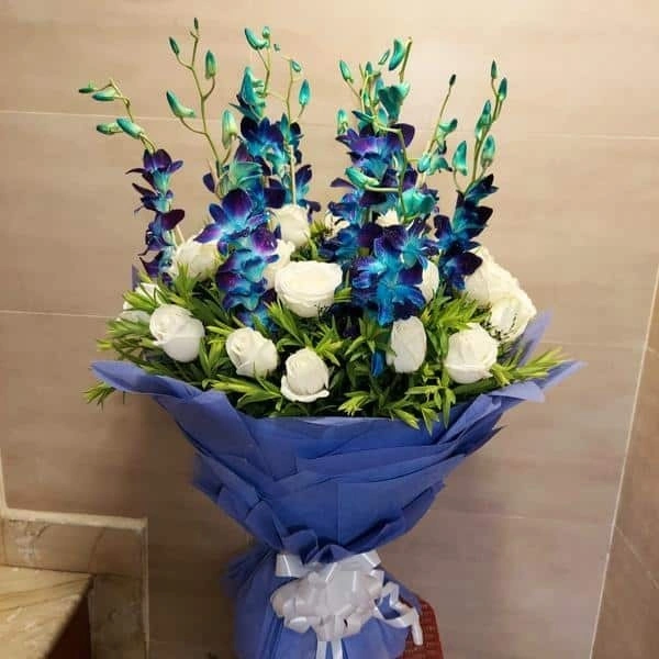 white rose and orchids bouquet