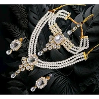 The Stunning Rock combo necklace set with earrings and maang tika