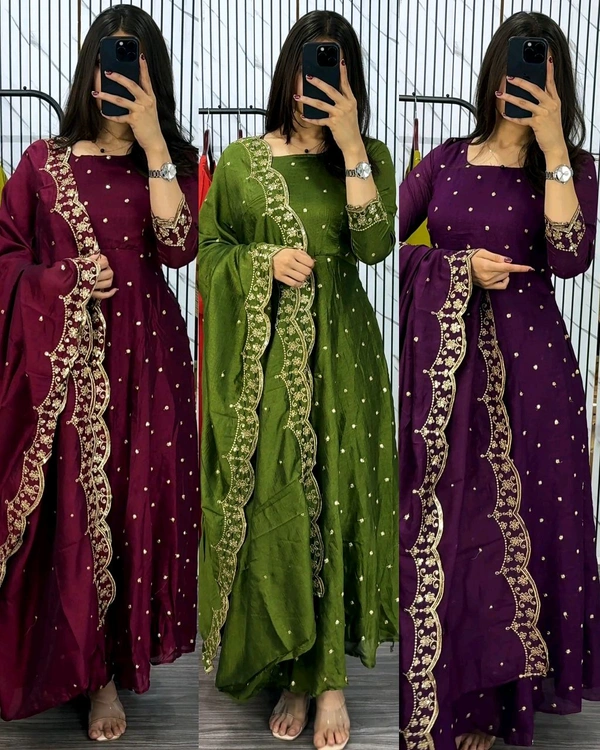 Introducing our Striking Vichitra Anarkali Adorned with Exquisite Embroidery. Paired with a delicate Border dupatta, this ensemble exudes elegance and sophistication, perfect for any special occasion - Burgundy, S