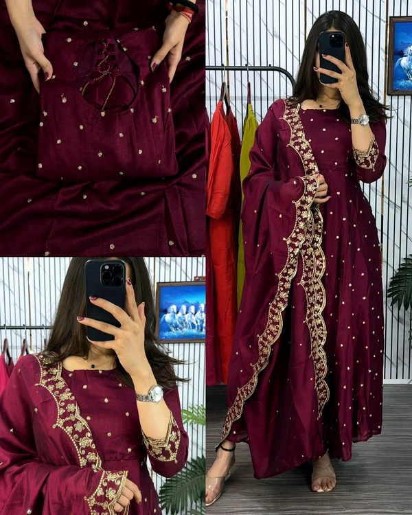 Introducing our Striking Vichitra Anarkali Adorned with Exquisite Embroidery. Paired with a delicate Border dupatta, this ensemble exudes elegance and sophistication, perfect for any special occasion - Burgundy, S