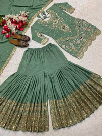 Stylish Heavy Work Teal Green Color Sharara Suit
- Pista, L