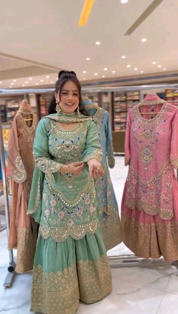 Stylish Heavy Work Teal Green Color Sharara Suit
- Pista, M