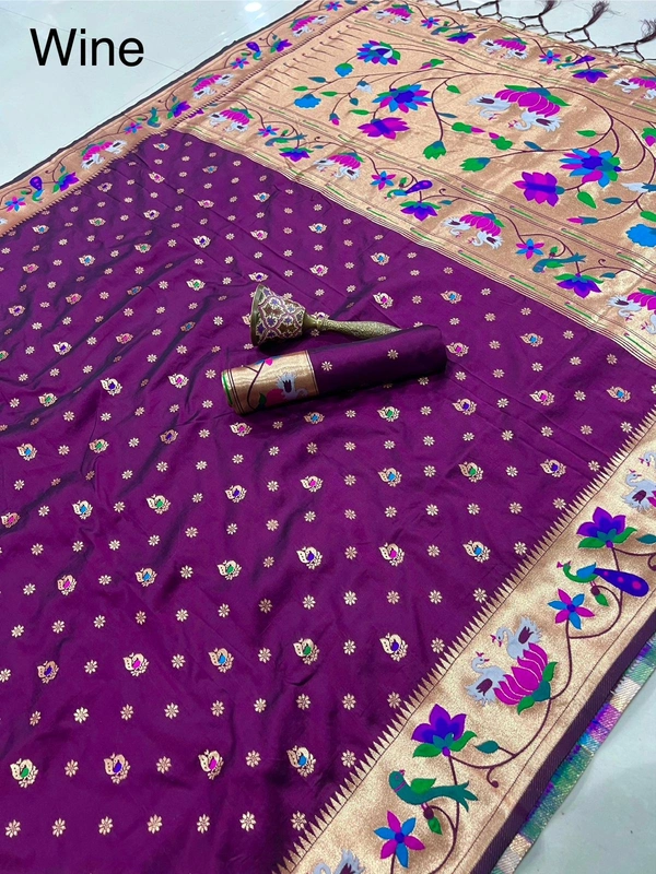 Luxurious  Silk Saree featuring Traditional Paithani Motifs and Contrast Border