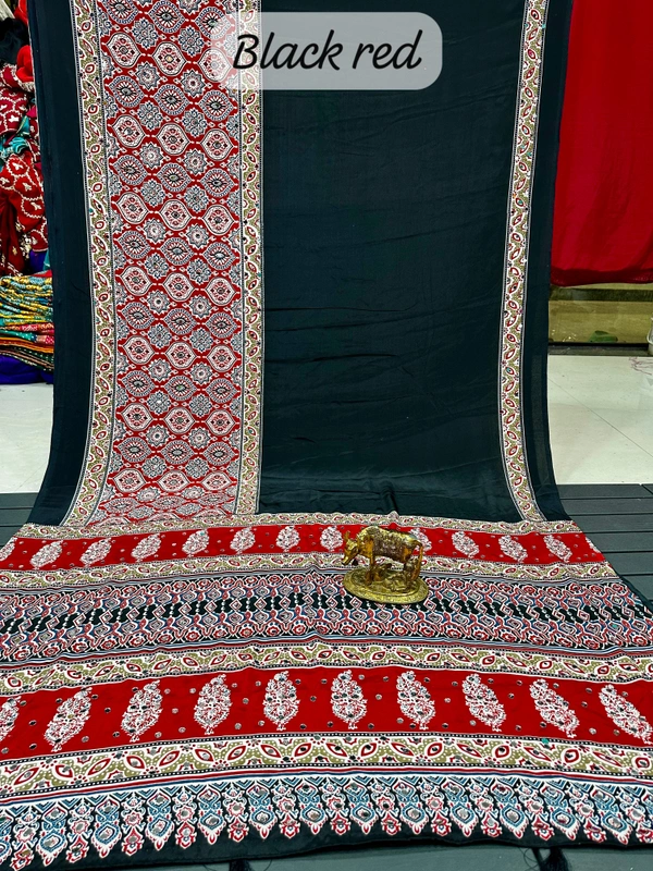 Rukmini Jet Black Casual Elegance Ajrakh Saree with Contrast Red Ornamental Floral Jaal Printed Border and Mirror Pallu - Free, Black Red