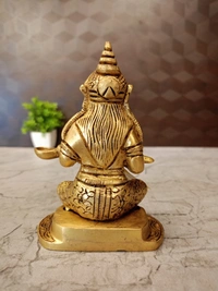 Brass Annapoorani Sitting On Round Designer Base