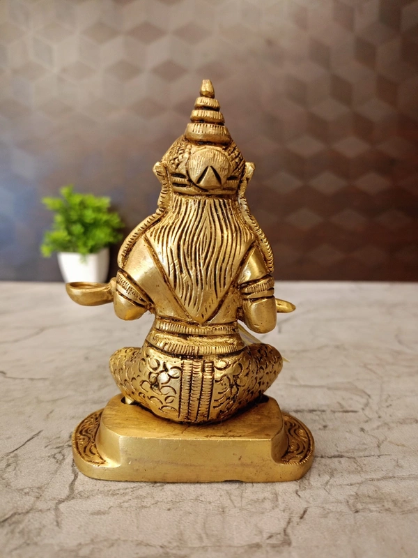 Brass Annapoorani Sitting On Round Designer Base