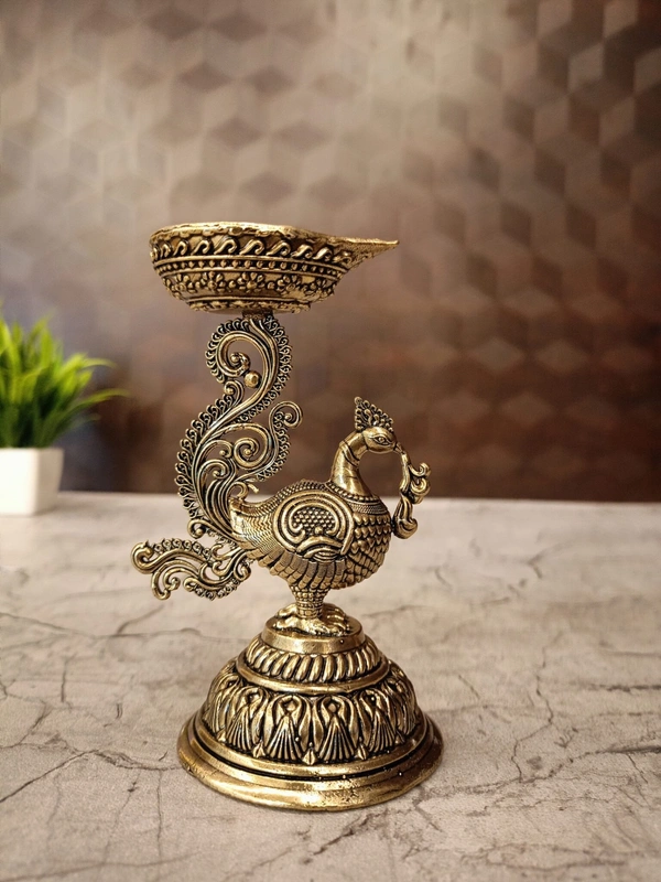 Brass Fine Art Peacock Holding Diya