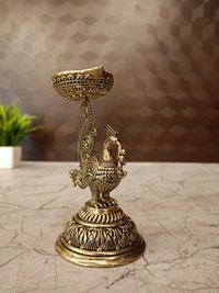 Brass Fine Art Peacock Holding Diya