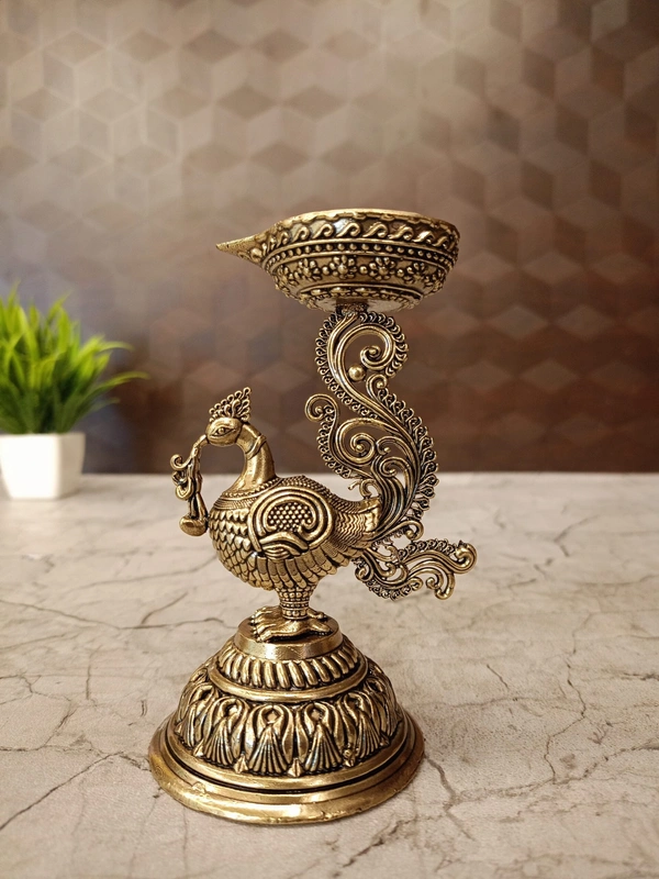 Brass Fine Art Peacock Holding Diya