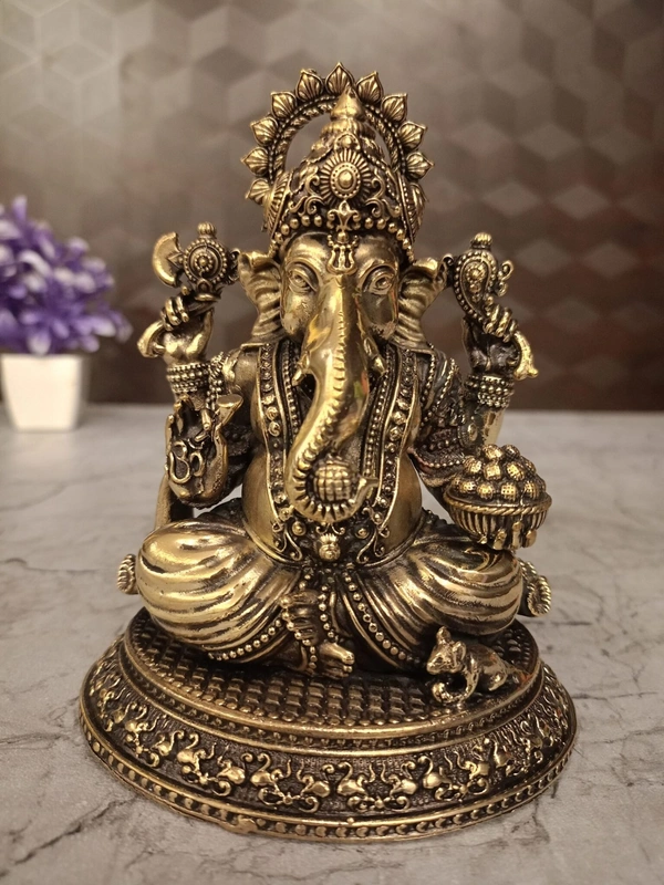 Brass Ganesha Sitting On Oval Base Idol