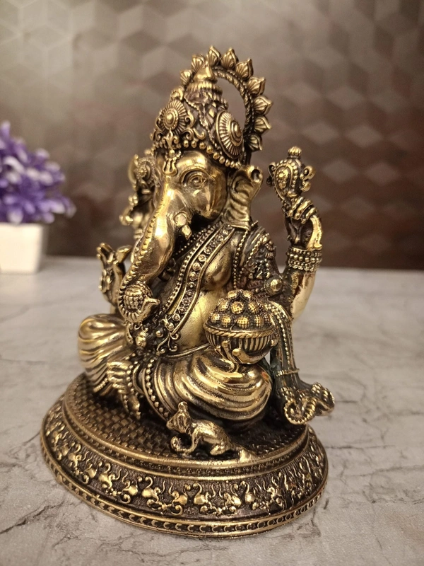 Brass Ganesha Sitting On Oval Base Idol