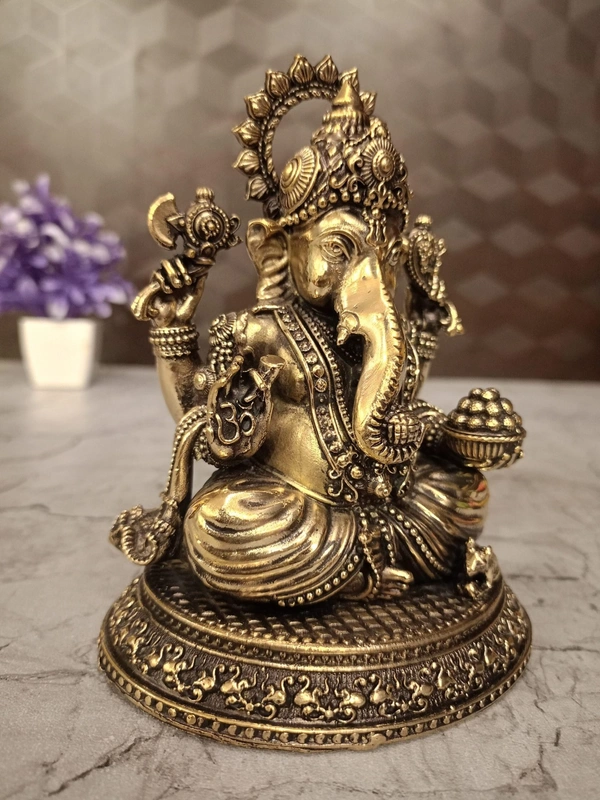 Brass Ganesha Sitting On Oval Base Idol