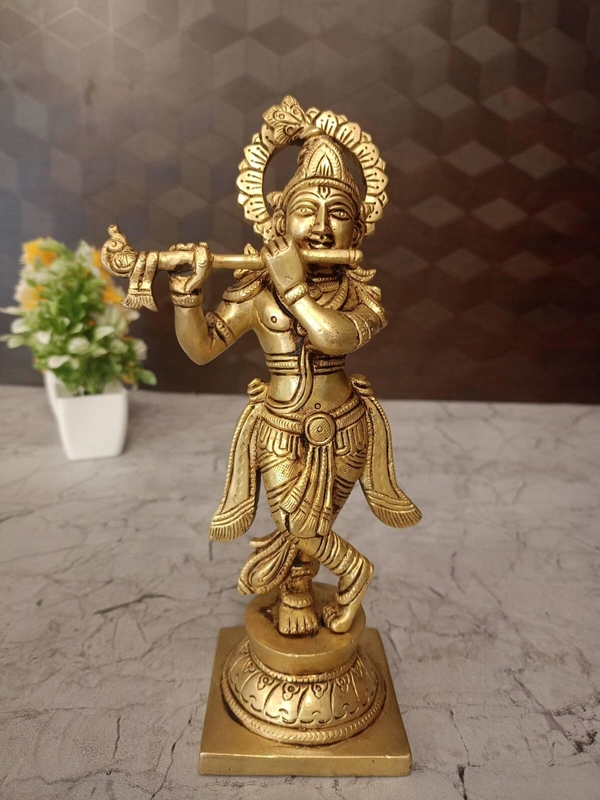 Brass Krishna with peacock feather on head