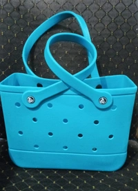 Crocs bag restocked in a new size Charms included