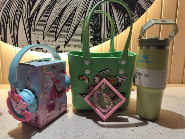 Crocs bag combo 2 Crocs bag with charms (18 cms) Wireless headphone(girl or boy choice possible) 🎧 non Stanley 900 ml capacity tumbler * Bracelet(for boy spinner can be done). Color random throughout