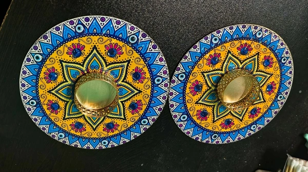 Mdf tealight holder in mandala and evil eye and butterfly.Buy any design 2 pcs. Wax tealight included Size 4 inches