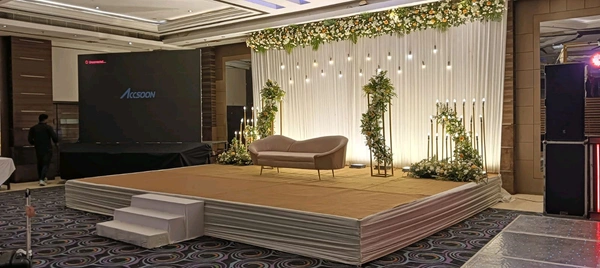 Elegant Wedding Stage with Floral Border & Hanging Lights (Banquet Setup)