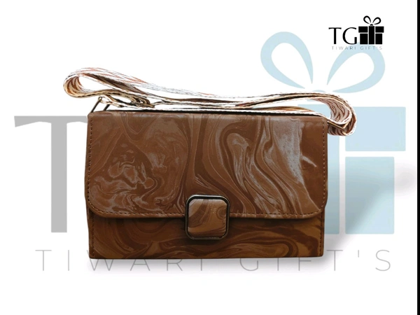 DARK BROWN faux leather sling bag with a marble pattern and a broad detachable strap.