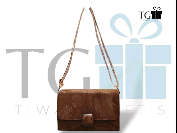 DARK BROWN faux leather sling bag with a marble pattern and a broad detachable strap.
