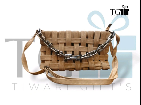 LIGHT BROWN Faux PU LEATHER SLING BAG WITH A WOVEN MAT DESIGN AND A METAL CHAIN ACCENT.