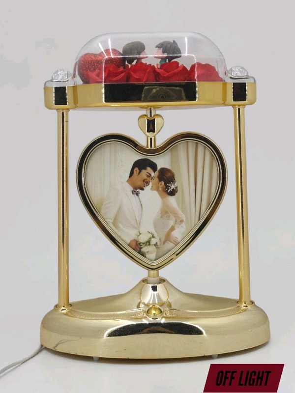 a personalized heart-shaped LED photo frame lamp with a rotating center photo display.