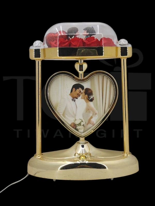 a personalized heart-shaped LED photo frame lamp with a rotating center photo display.