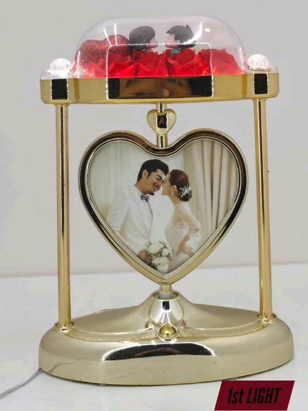a personalized heart-shaped LED photo frame lamp with a rotating center photo display.