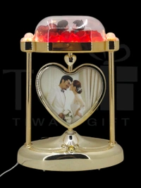 a personalized heart-shaped LED photo frame lamp with a rotating center photo display.