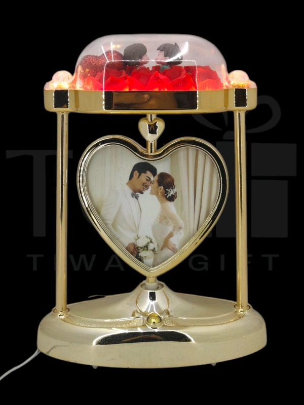 a personalized heart-shaped LED photo frame lamp with a rotating center photo display.