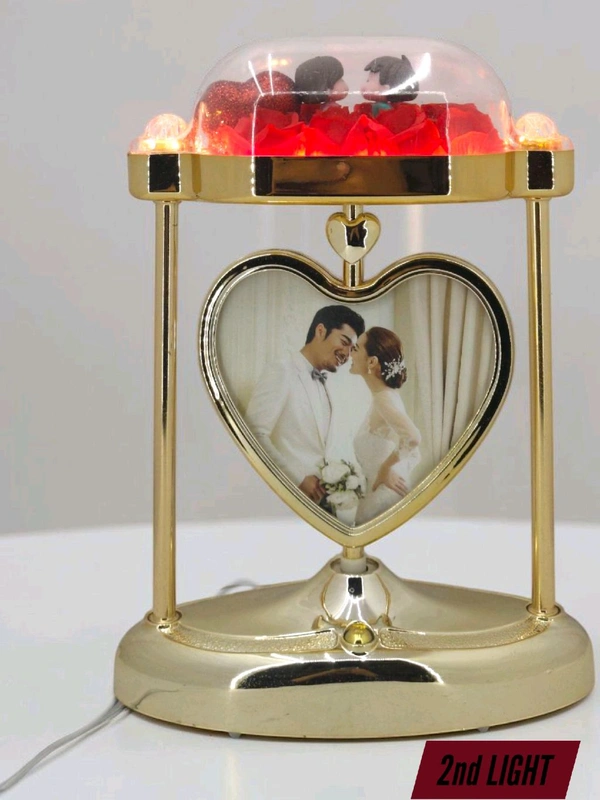 a personalized heart-shaped LED photo frame lamp with a rotating center photo display.