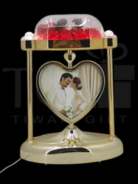 a personalized heart-shaped LED photo frame lamp with a rotating center photo display.
