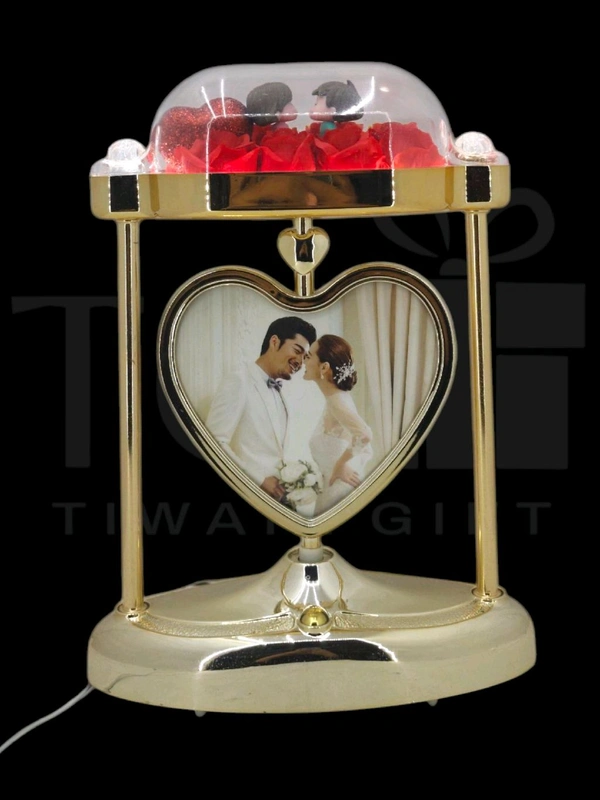 a personalized heart-shaped LED photo frame lamp with a rotating center photo display.