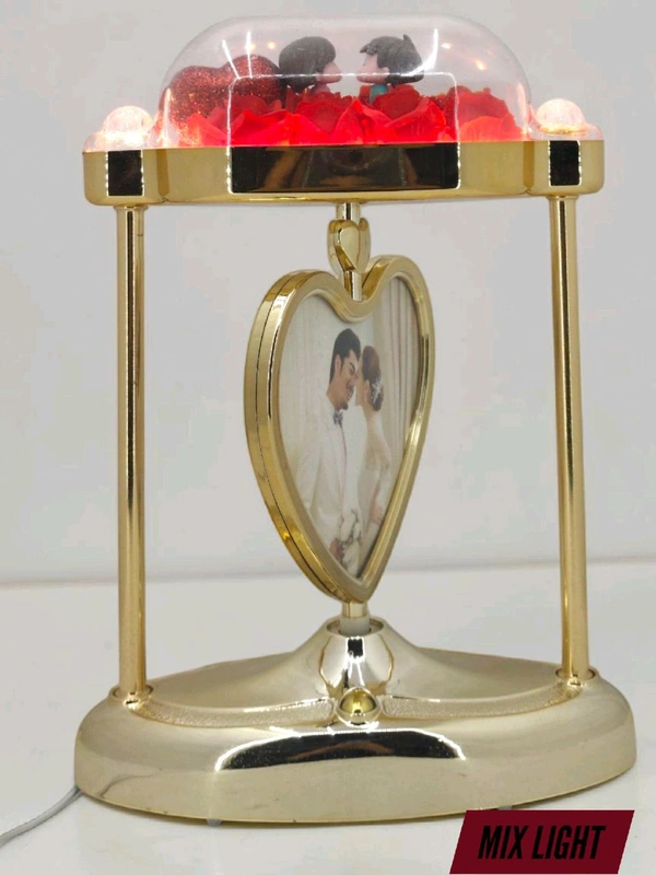 a personalized heart-shaped LED photo frame lamp with a rotating center photo display.