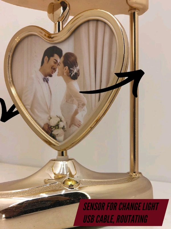 a personalized heart-shaped LED photo frame lamp with a rotating center photo display.