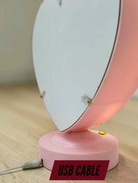 personalized heart-shaped LED photo frame with decorative floral elements, similar to products offered by brands like ND Enterprise or Archies.