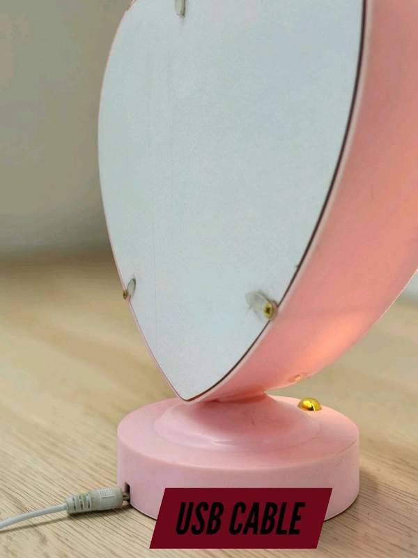 personalized heart-shaped LED photo frame with decorative floral elements, similar to products offered by brands like ND Enterprise or Archies.