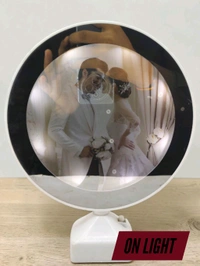 TaffHome Magic Mirror with Photo Frame is a functional table mirror that turns into an illuminated photo frame when connected to electricity.