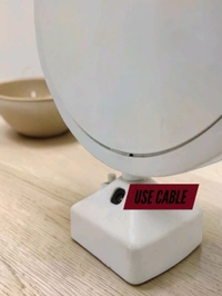 TaffHome Magic Mirror with Photo Frame is a functional table mirror that turns into an illuminated photo frame when connected to electricity.