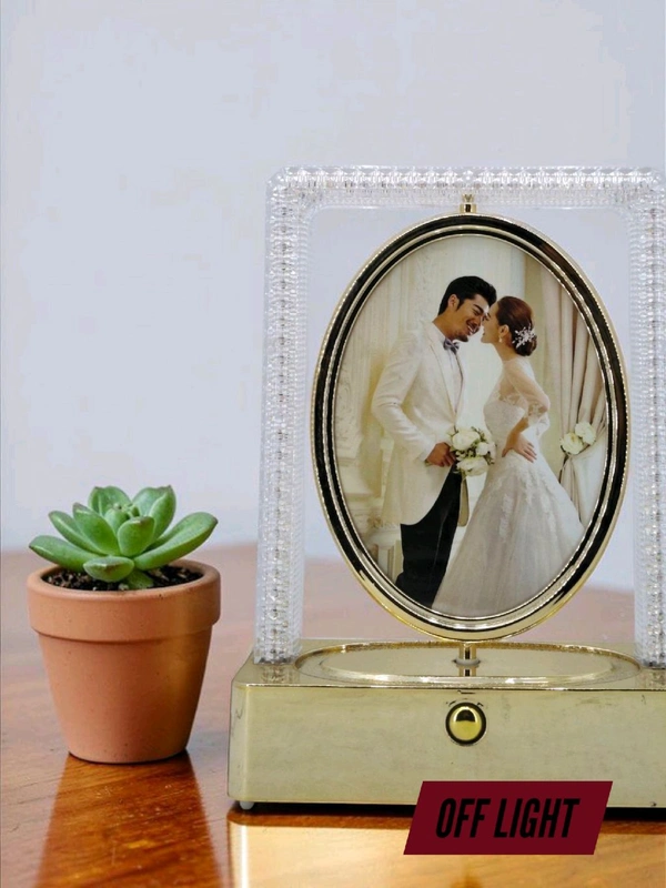 rotating photo frame lamp often branded as a Crystal Rotating LED Photo Lamp.
