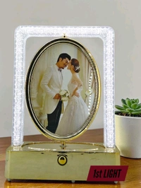 rotating photo frame lamp often branded as a Crystal Rotating LED Photo Lamp.