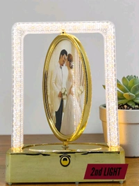 rotating photo frame lamp often branded as a Crystal Rotating LED Photo Lamp.